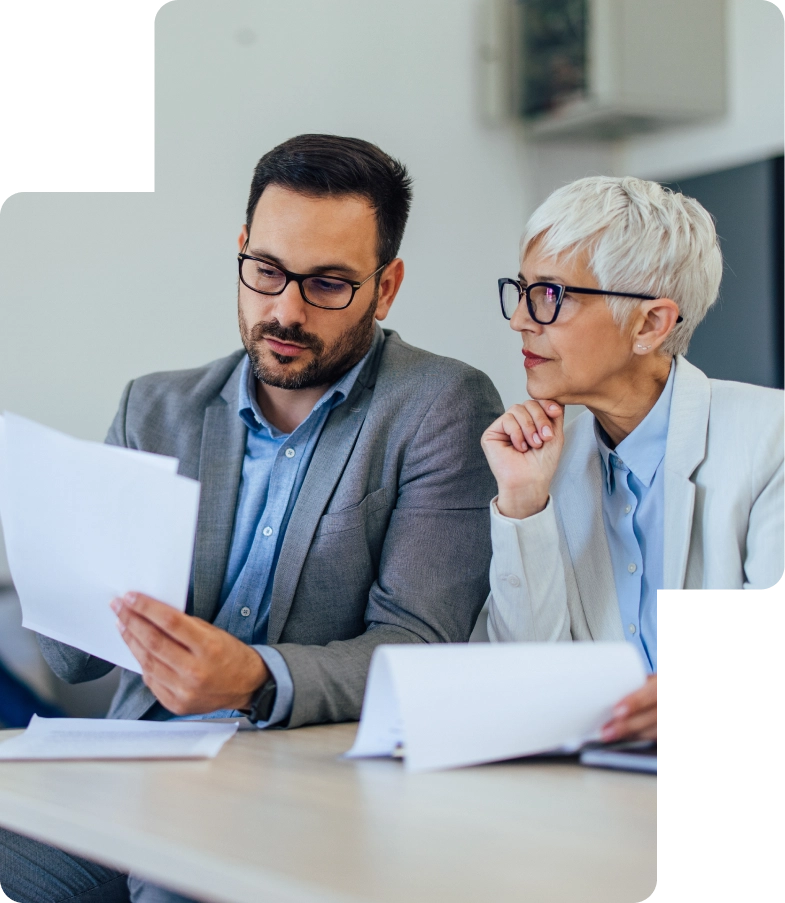 Consultant reviewing financial charts and documents for VAT compliance and business registration