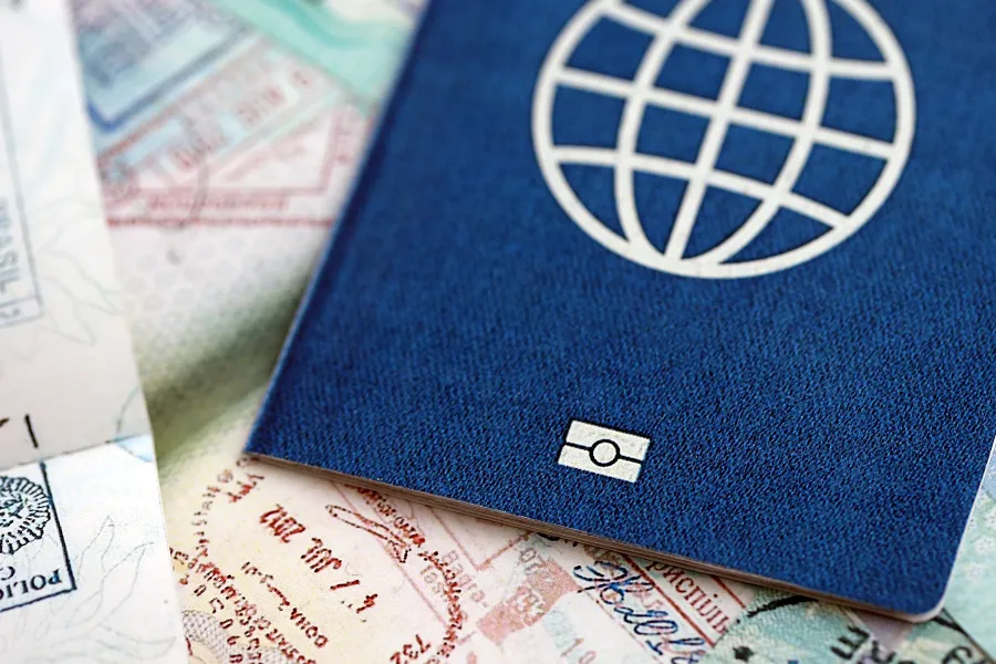 Passport and visa application documents for international business travel